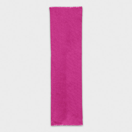 Discover the fucsia cashmere scarf, exclusively crafted in Italy. Shop this luxurious mono color scarf at Wools Boutique Uomo in Geneva.