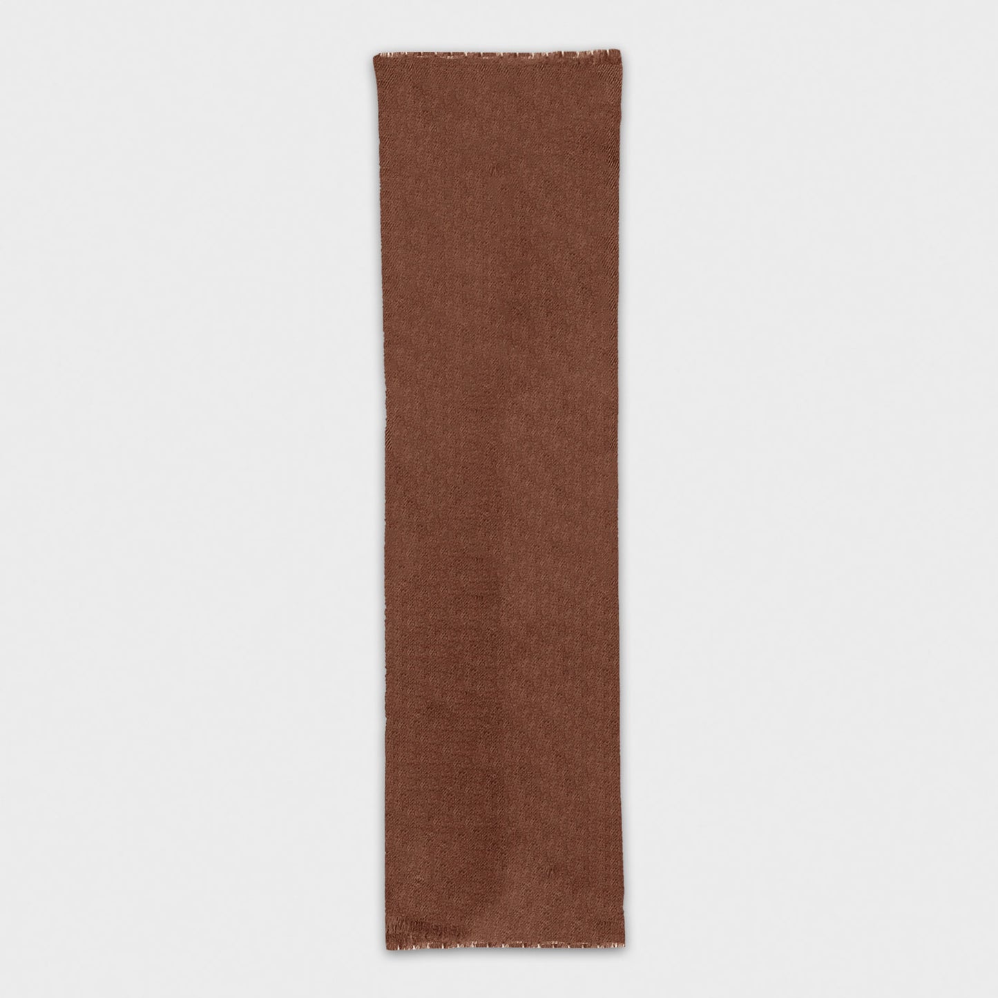 Discover the cognac brown cashmere scarf, exclusively crafted in Italy. Shop this luxurious mono color scarf at Wools Boutique Uomo in Geneva.