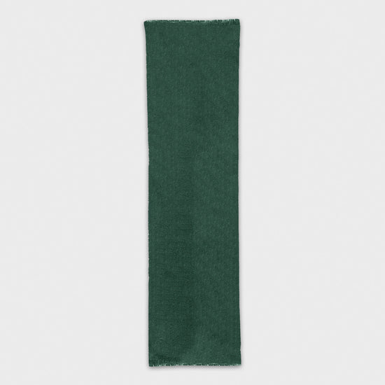 Discover the forest green cashmere scarf, exclusively crafted in Italy. Shop this luxurious mono color scarf at Wools Boutique Uomo in Geneva.