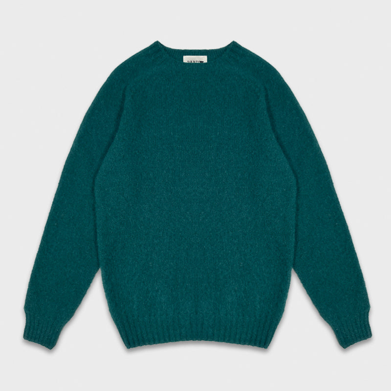 Pull en laine Shetland vert à Genève. Pull en laine Shetland vert disponible dans Wools Boutique Uomo à Genève, fabriqué en Scotland par Barto, col côtelé, manches raglan, pulls chauds unisexes