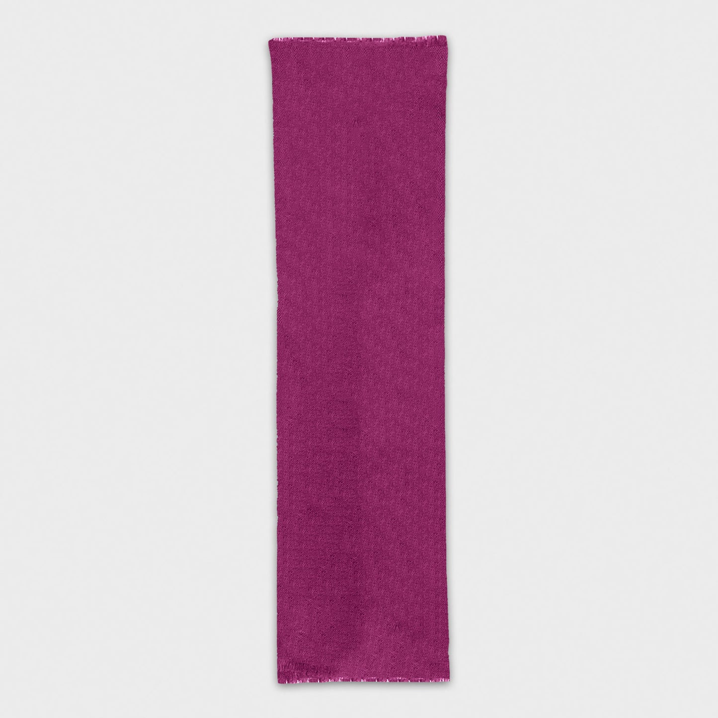 Explore our magenta cashmere scarf, exclusively crafted in Italy for Wools Boutique Uomo in Geneva. Refined mono color scarf for your elegant outfits.