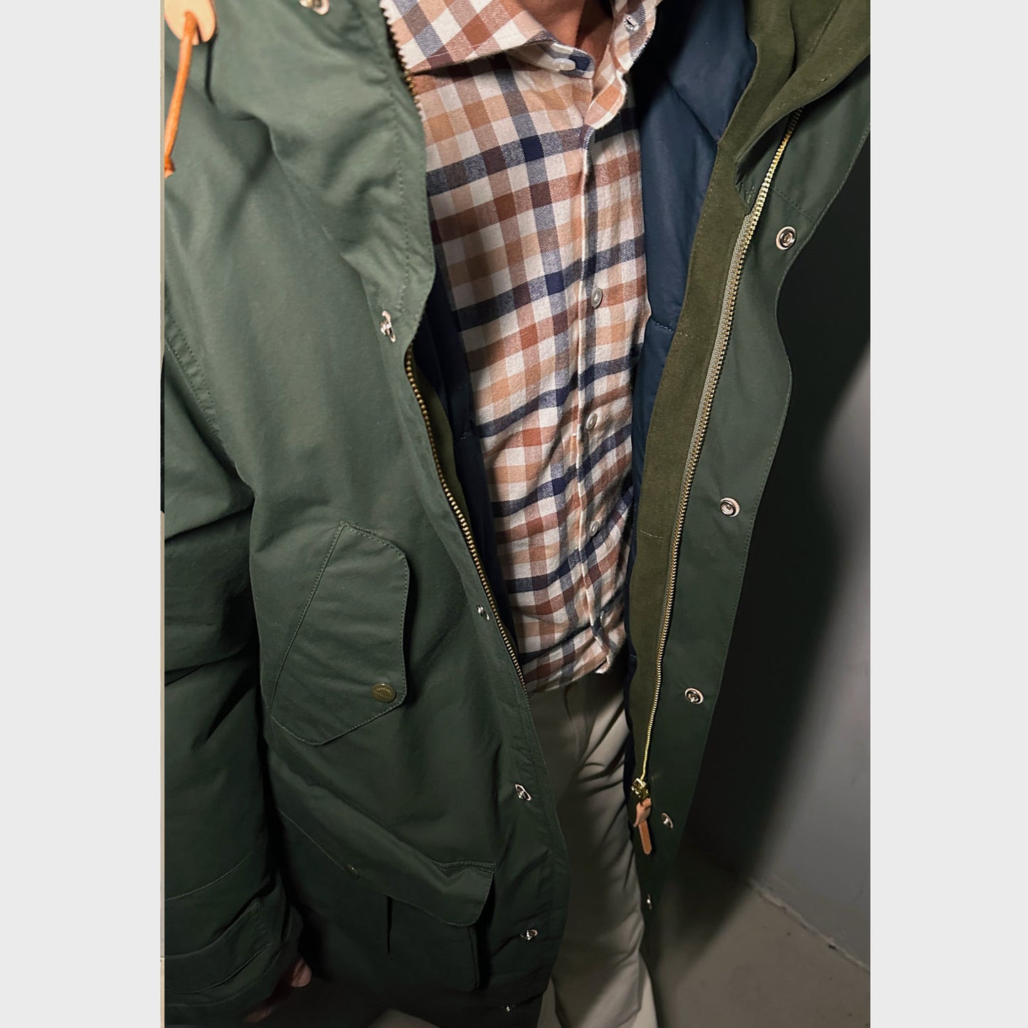 Men's padded parka coat made of water repellent cotton made in Italy by Manifattura Ceccarelli, an mens outerwear army green color that keeps you dry and comfortable.