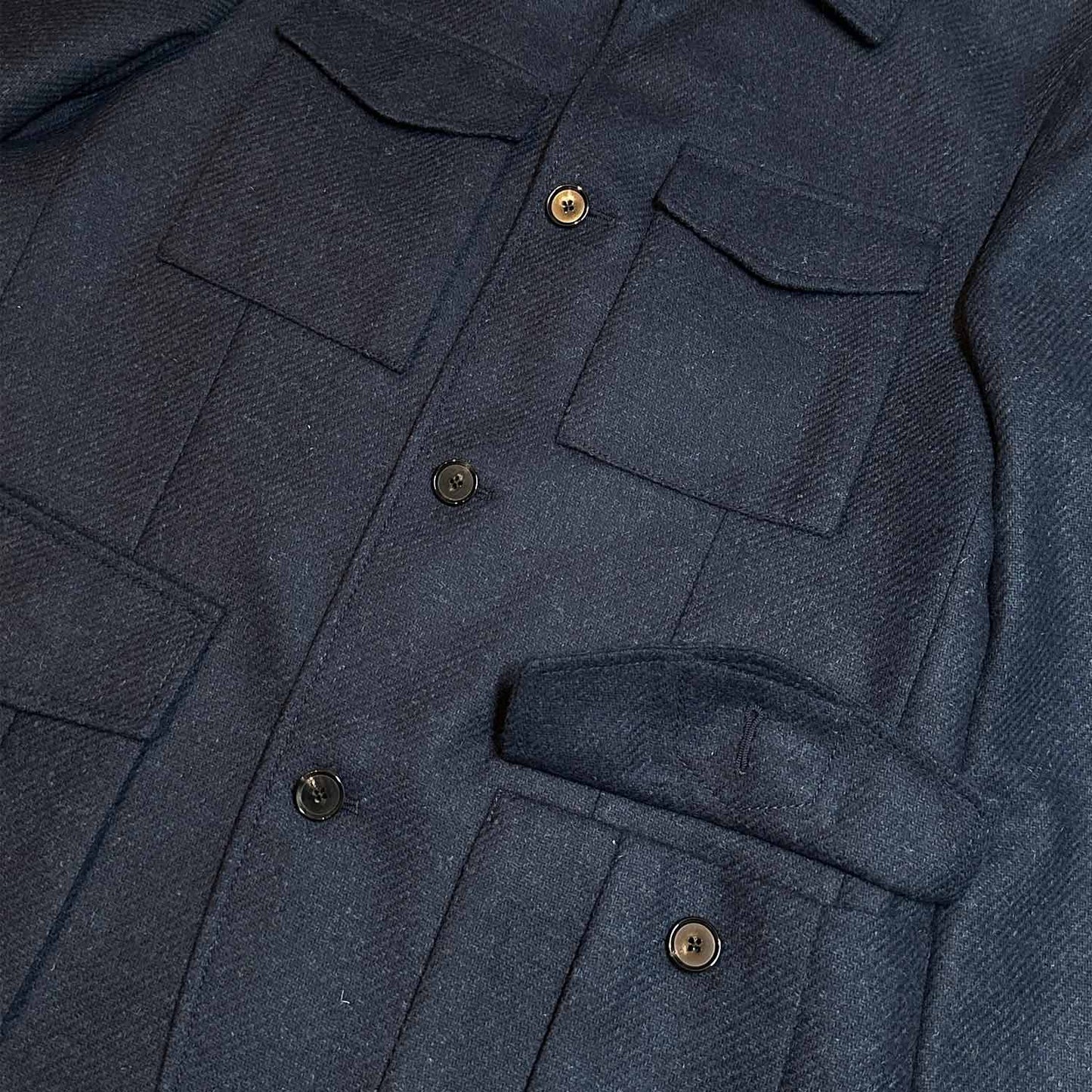 Refined mens wool tweed field jacket, made in Italy by Caruso exclusively for Wools Boutique Uomo Geneva. Warm and soft denim blue color make this jacket ideal for a timeless outfit.