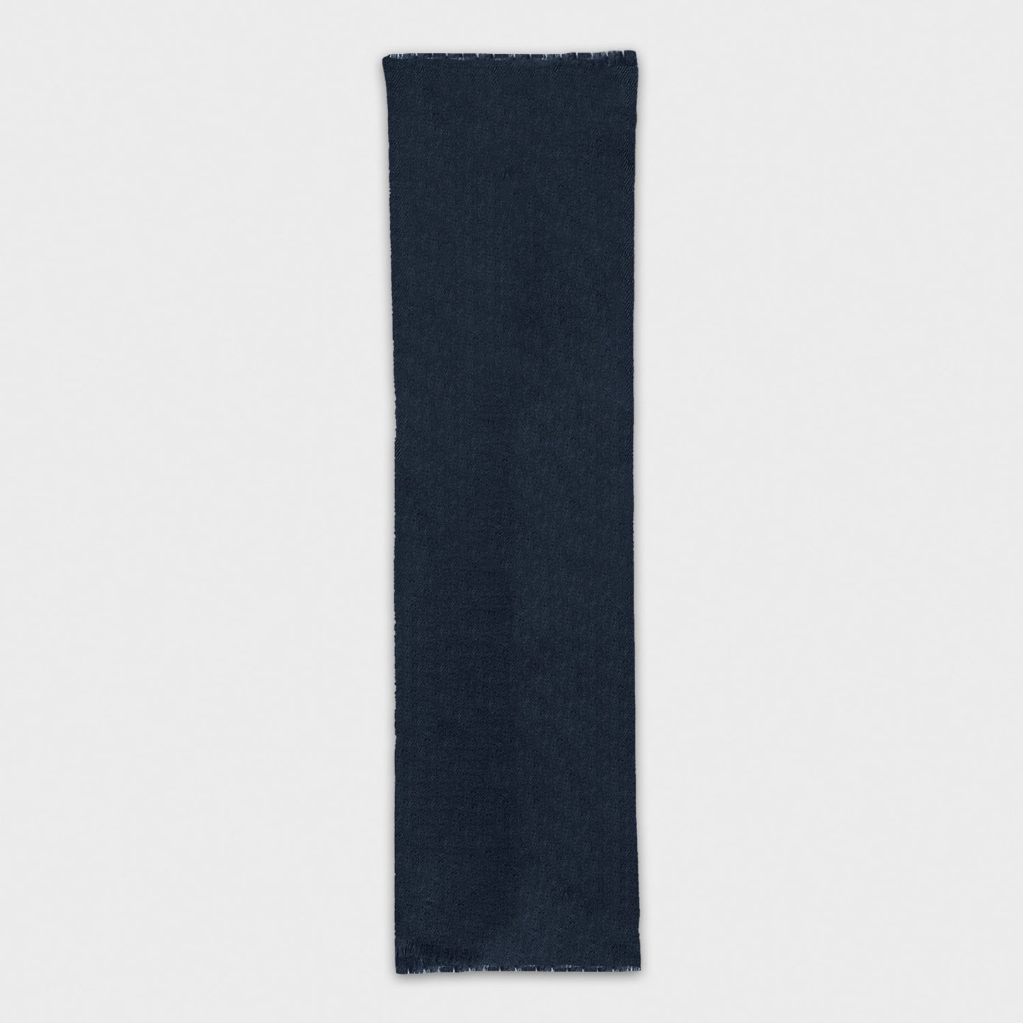 Discover the timeless navy blue cashmere scarf made in Italy, available at Wools Boutique Uomo in Geneva. Shop the finest mono color scarf for a touch of luxury.