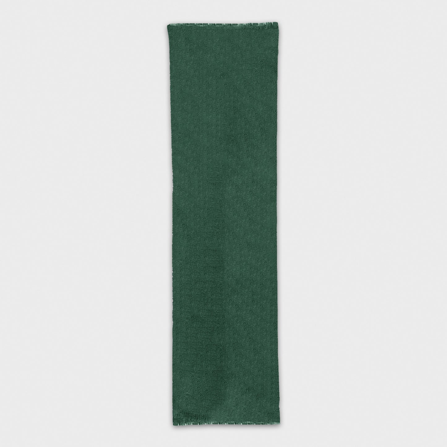 Experience the luxury of a high-quality with mono color scarf. Shop the pine green cashmere scarf made in Italy at Wools Boutique Uomo in Geneva.