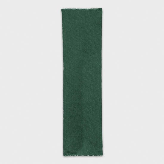 Experience the luxury of a high-quality with mono color scarf. Shop the pine green cashmere scarf made in Italy at Wools Boutique Uomo in Geneva.