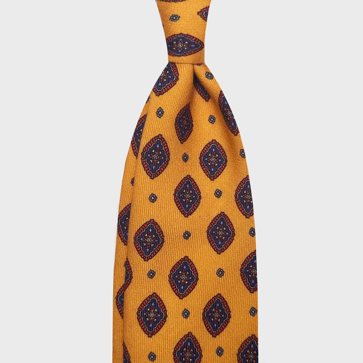 Ocra Yellow Diamonds Printed Wool Tie Shop Genève. Elegant yellow wool tie made with finest Italian wool soft fabric to the touch, handmade in Italy exclusive for Wools Boutique Uomo in Geneva